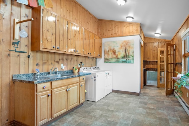 437 Tie Chute Ln, Florence, MT 59833 - washroom featuring washer and clothes dryer, cabinet space, baseboards, wooden walls, and a baseboard heating unit