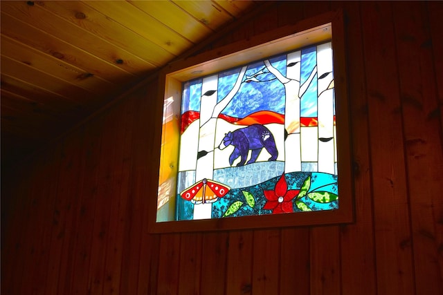 details featuring wooden ceiling and wooden walls