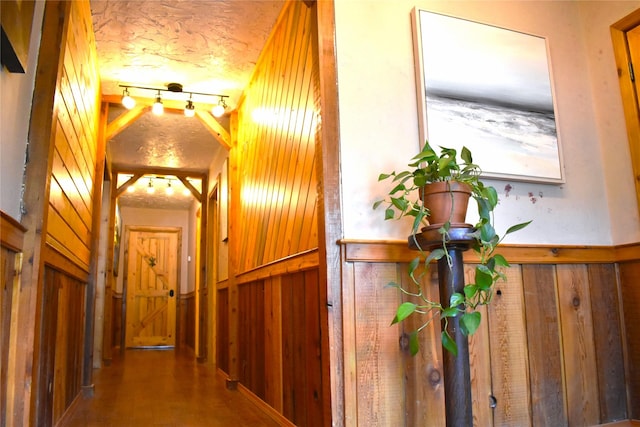 437 Tie Chute Ln, Florence, MT 59833 - hallway featuring wooden walls and a wainscoted wall