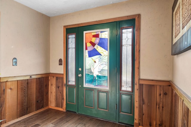 437 Tie Chute Ln, Florence, MT 59833 - foyer entrance featuring a wainscoted wall, wood finished floors, and wood walls