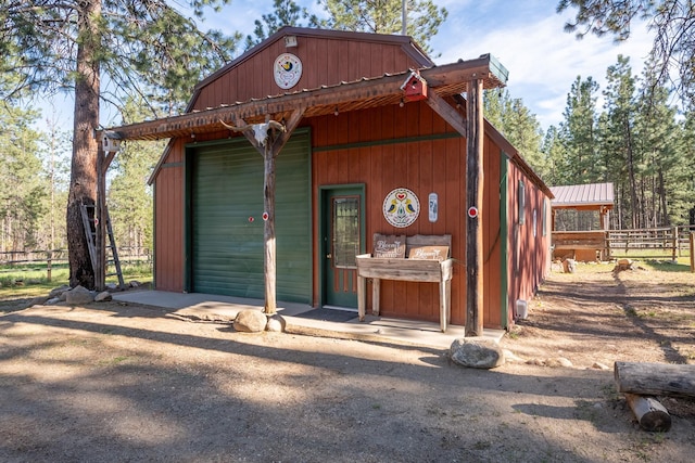 437 Tie Chute Ln, Florence, MT 59833 - view of outbuilding featuring fence and an outbuilding