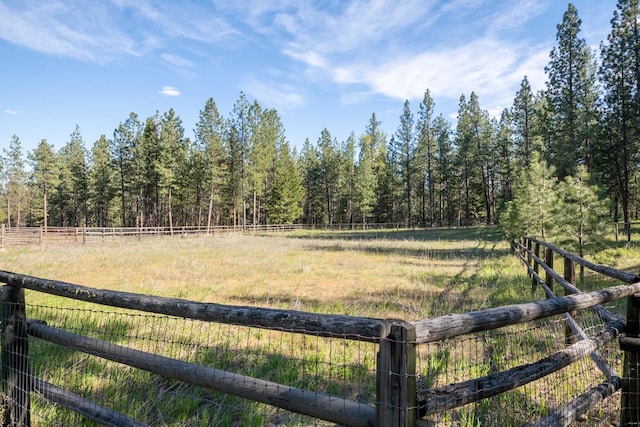 437 Tie Chute Ln, Florence, MT 59833 - view of yard featuring fence, a view of trees, and a rural view