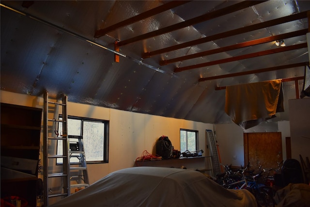 bedroom featuring lofted ceiling