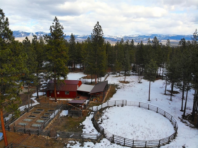 snowy aerial view featuring a mountain view