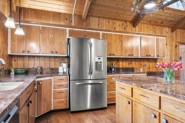 437 Tie Chute Ln, Florence, MT 59833 - kitchen featuring stainless steel fridge, a sink, beamed ceiling, wooden ceiling, and wood finished floors