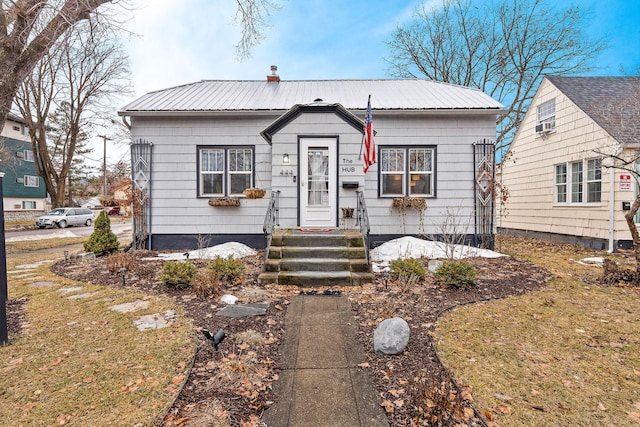 bungalow-style home featuring metal roof