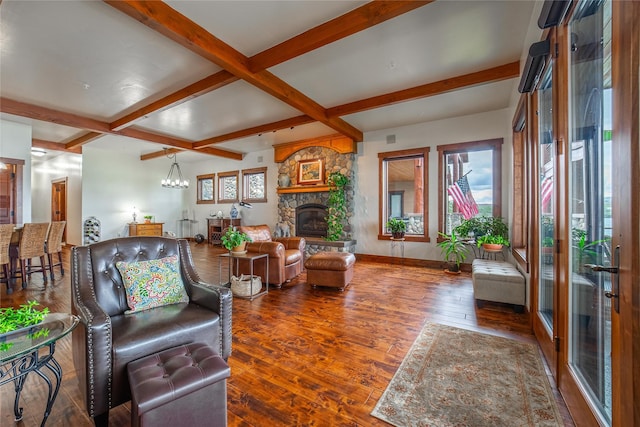 living room featuring a stone fireplace, coffered ceiling, baseboards, hardwood / wood-style floors, and beamed ceiling