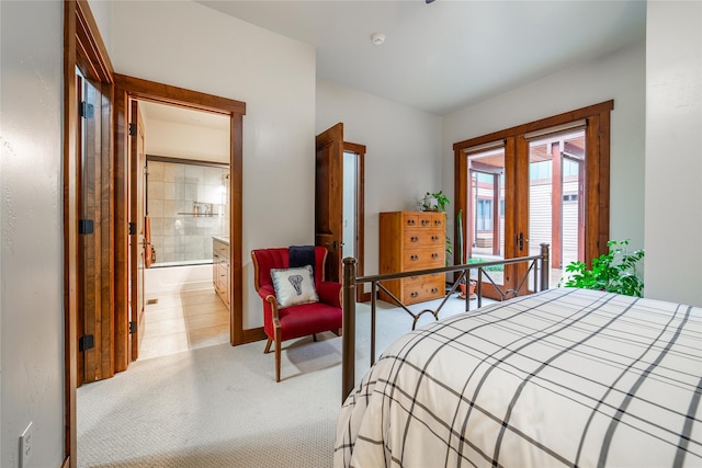 bedroom featuring light carpet and connected bathroom