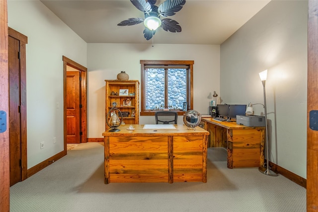 carpeted home office featuring ceiling fan and baseboards