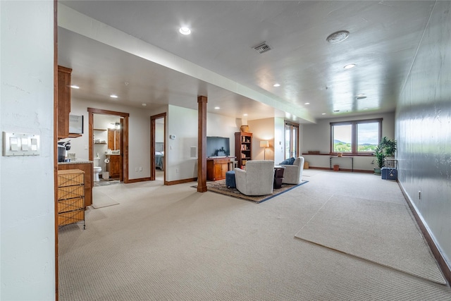 living area featuring recessed lighting, light carpet, visible vents, and baseboards