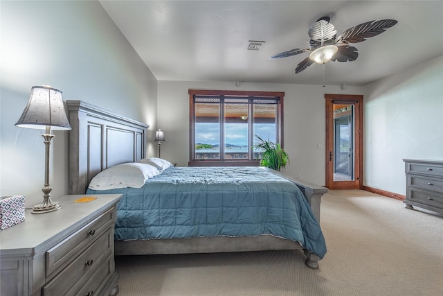 bedroom with light carpet, baseboards, visible vents, a ceiling fan, and access to exterior