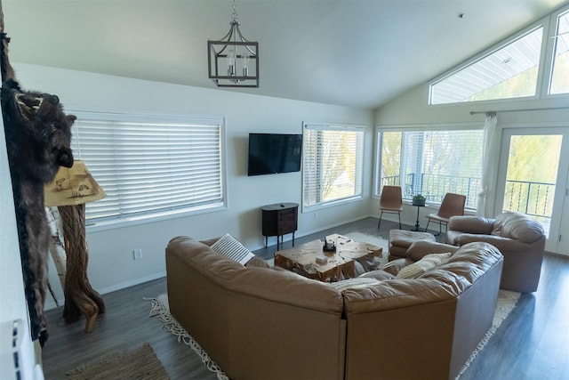50550 US Highway 93 Unit 6, Polson, MT 59860 - living room featuring baseboards, a chandelier, vaulted ceiling, and wood finished floors