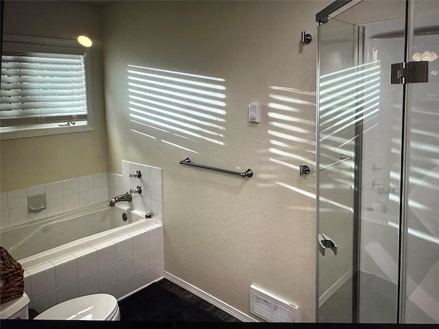 50550 US Highway 93 Unit 6, Polson, MT 59860 - full bath featuring toilet, a stall shower, visible vents, and a bath
