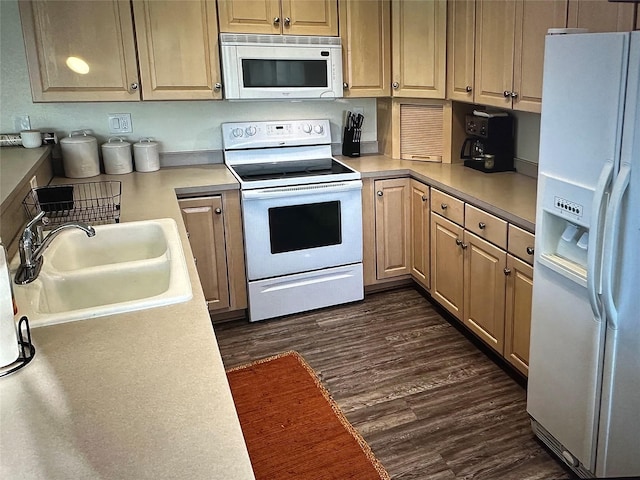 50550 US Highway 93 Unit 6, Polson, MT 59860 - kitchen with light countertops, white appliances, dark wood-style flooring, and a sink