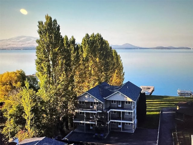 birds eye view of property featuring a water view