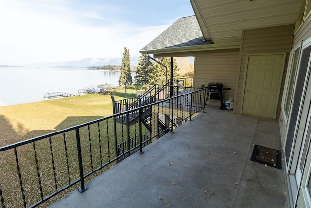 balcony featuring a water view