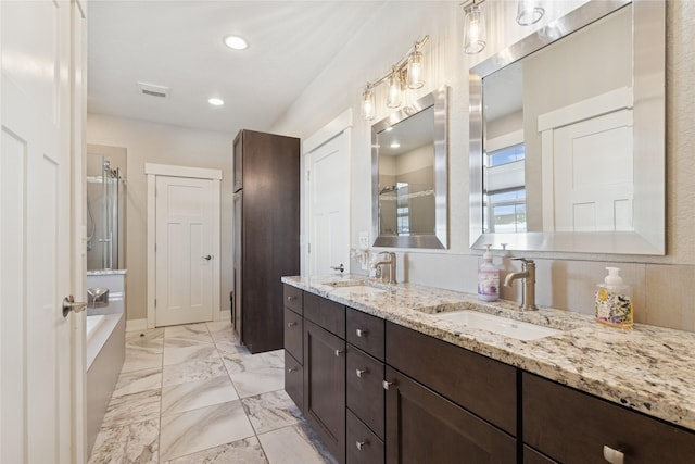 101 Shellan Way, Kalispell, MT 59901 - full bathroom with a stall shower, double vanity, a bath, marble finish flooring, and recessed lighting