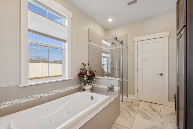 101 Shellan Way, Kalispell, MT 59901 - bathroom with a bath, a shower stall, and marble look tile flooring