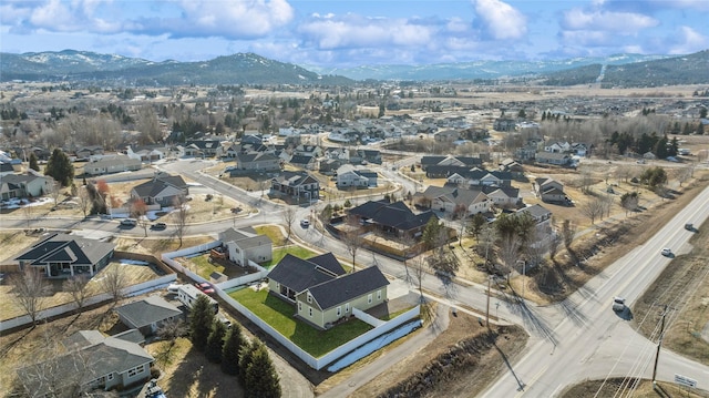 101 Shellan Way, Kalispell, MT 59901 - aerial view of property and surrounding area with a mountain backdrop and nearby suburban area