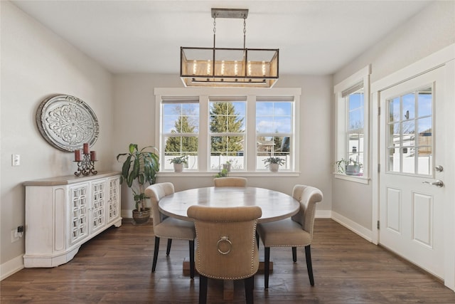 101 Shellan Way, Kalispell, MT 59901 - dining room with plenty of natural light, a chandelier, and dark wood finished floors