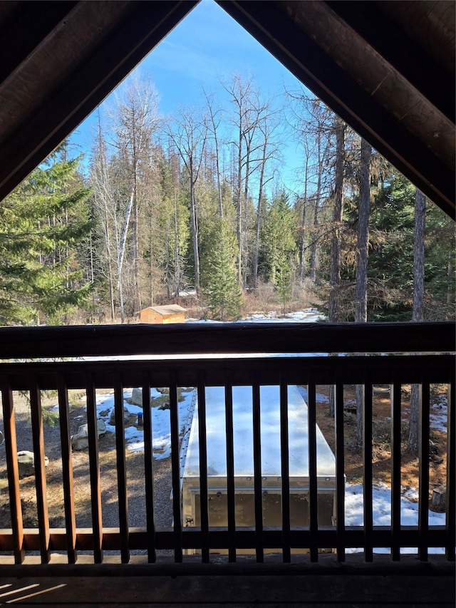 balcony featuring a view of trees