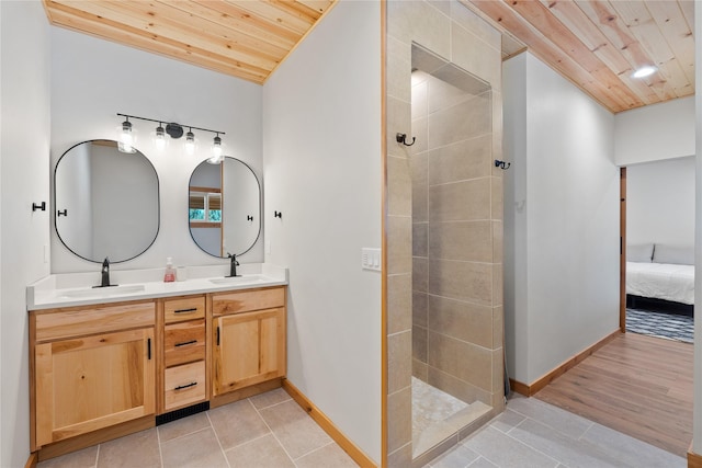 full bath with wooden ceiling, walk in shower, a sink, and double vanity