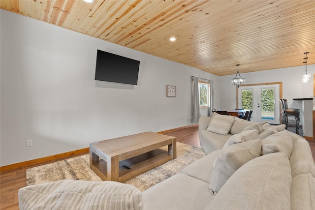 living area featuring wooden ceiling, recessed lighting, wood finished floors, baseboards, and french doors