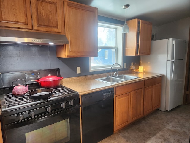 kitchen with under cabinet range hood, a sink, light countertops, black appliances, and brown cabinetry