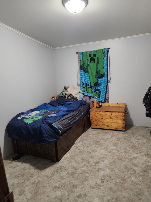 bedroom with ornamental molding and carpet flooring