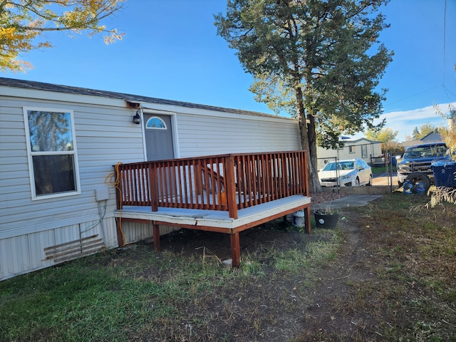 wooden terrace with a gate and fence