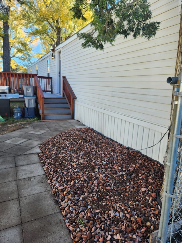 view of side of home featuring a deck