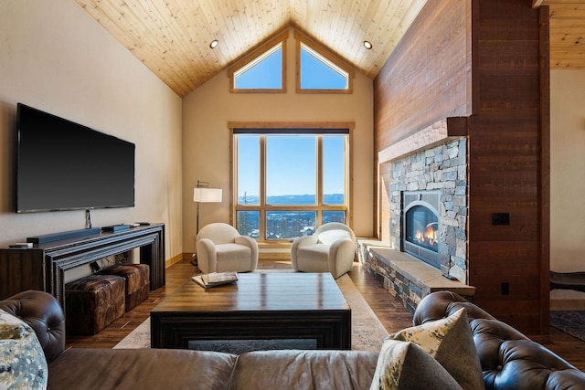 living area featuring high vaulted ceiling, a fireplace, wood finished floors, and wood ceiling