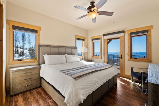 476 Elk Highlands Dr, Whitefish, MT 59937 - bedroom featuring access to exterior, dark wood-type flooring, and multiple windows