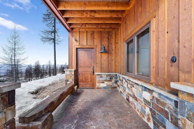 view of snow covered property entrance