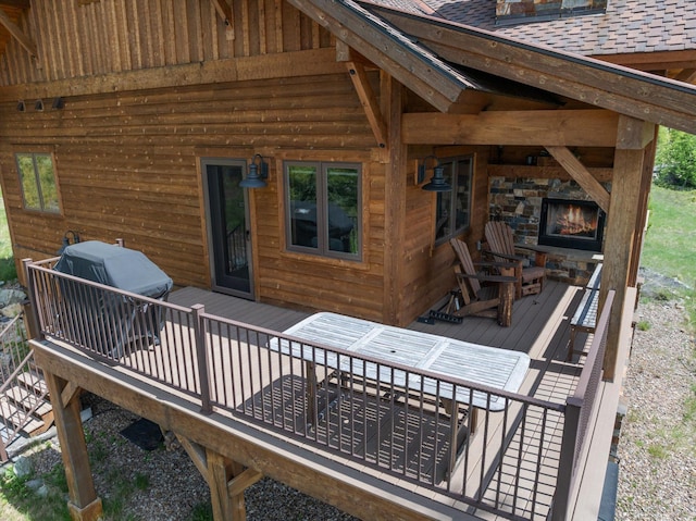 476 Elk Highlands Dr, Whitefish, MT 59937 - wooden terrace featuring an outdoor stone fireplace