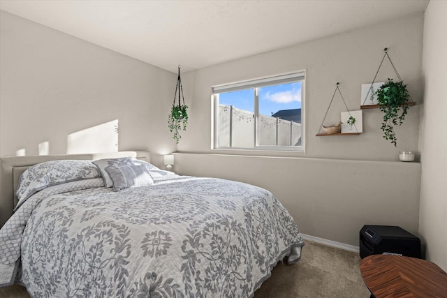 bedroom with carpet flooring and baseboards