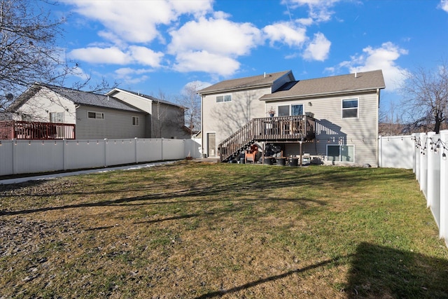 rear view of property with stairs, a yard, a fenced backyard, and a wooden deck