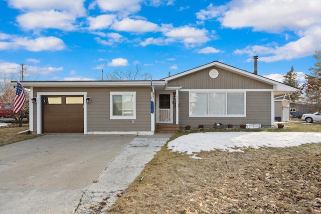 ranch-style home featuring a garage and driveway