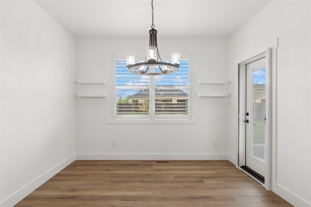 154 W Swift Creek Way, Kalispell, MT 59901 - unfurnished dining area with a chandelier and light wood finished floors