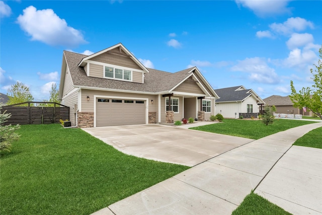 154 W Swift Creek Way, Kalispell, MT 59901 - craftsman house with stone siding, concrete driveway, a shingled roof, and an attached garage