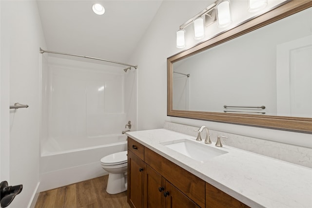 154 W Swift Creek Way, Kalispell, MT 59901 - bathroom featuring vanity, wood finished floors, bathtub / shower combination, and lofted ceiling