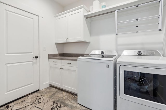 154 W Swift Creek Way, Kalispell, MT 59901 - laundry room with washer and dryer, light marble finish flooring, and cabinet space