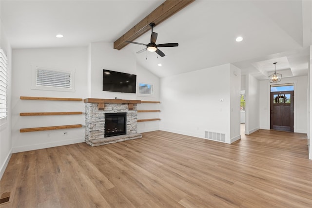 154 W Swift Creek Way, Kalispell, MT 59901 - unfurnished living room featuring light wood-type flooring, ceiling fan, a stone fireplace, recessed lighting, and a chandelier