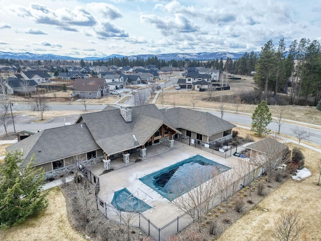 154 W Swift Creek Way, Kalispell, MT 59901 - view of swimming pool with a fenced backyard, a residential view, a mountain view, and a patio area