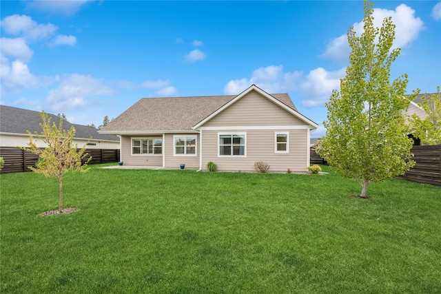 154 W Swift Creek Way, Kalispell, MT 59901 - back of property with a fenced backyard and roof with shingles