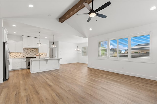154 W Swift Creek Way, Kalispell, MT 59901 - unfurnished living room featuring a ceiling fan, light wood-type flooring, recessed lighting, and a chandelier