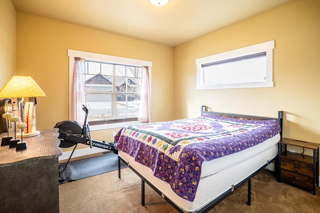 carpeted bedroom with baseboards