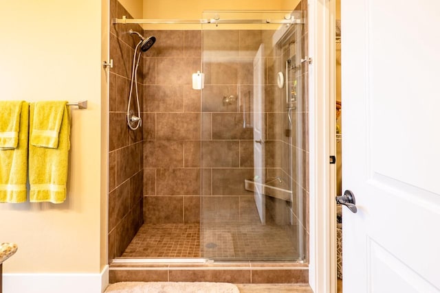 full bath featuring a shower stall