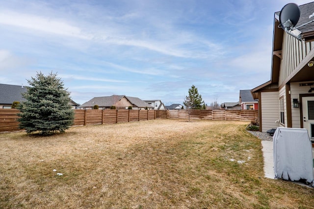 view of yard with a fenced backyard