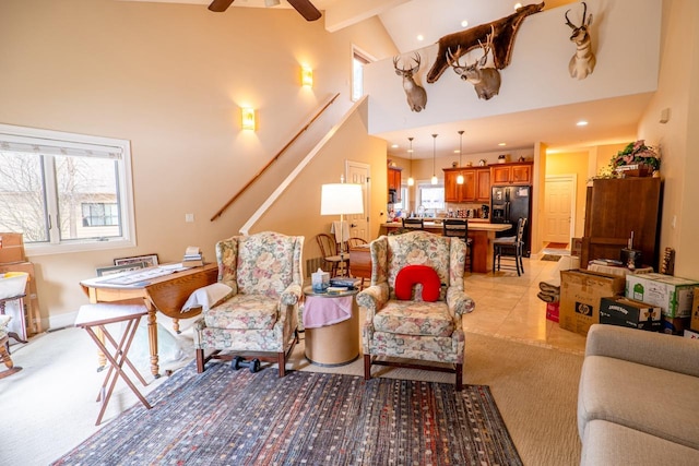 living room featuring light tile patterned floors, recessed lighting, a ceiling fan, high vaulted ceiling, and stairs